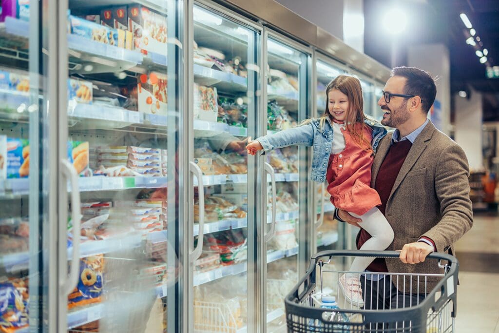 father and daughter at grocery store